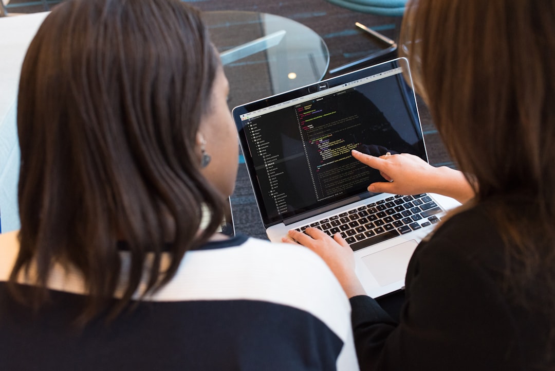 why-choose-us woman-using-macbook-pro-with-person-in-white-top-bpvm4noy0rg